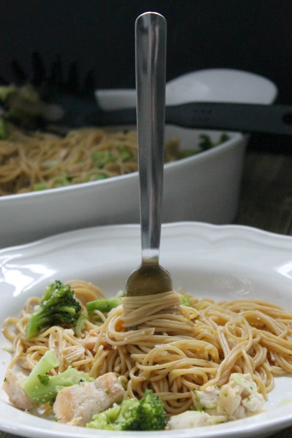 Healthier Chicken and Broccoli Pasta in a bowl with a fork.