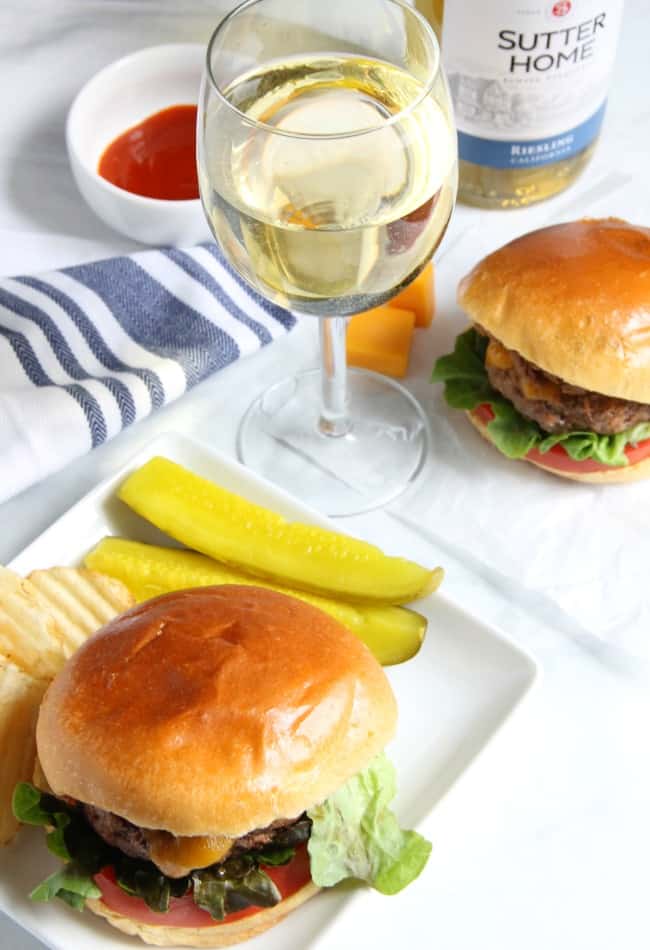 This Spicy Sriracha Juicy Lucy is a classic burger with a spicy twist! Found in Minnesota this burger pairs well with a glass of Sutter Home Riesling! | The Bitter Side of Sweet #SweetonSpice #ad Spicy Sriracha Juicy Lucy