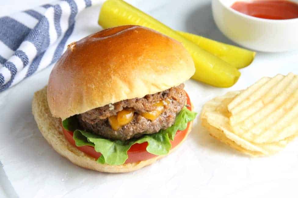 This Spicy Sriracha Juicy Lucy is a classic burger with a spicy twist! Found in Minnesota this burger pairs well with a glass of Sutter Home Riesling! | The Bitter Side of Sweet #SweetonSpice #ad Spicy Sriracha Juicy Lucy