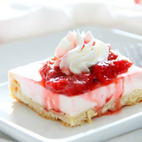Strawberry Cheesecake Shortbread Bars on white plate