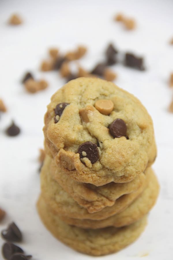 Soft and chewy Peanut Butter Chocolate Chip Cookies! Made with peanut butter chips these cookies bake up in less than 10 minutes! Peanut Butter Chocolate Chip Cookies on white background