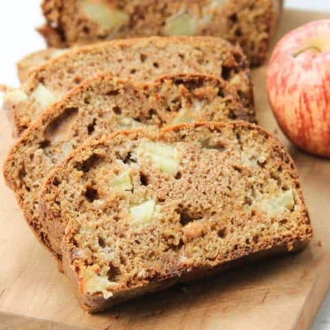 Caramel Apple Bread on brown cutting board in slices