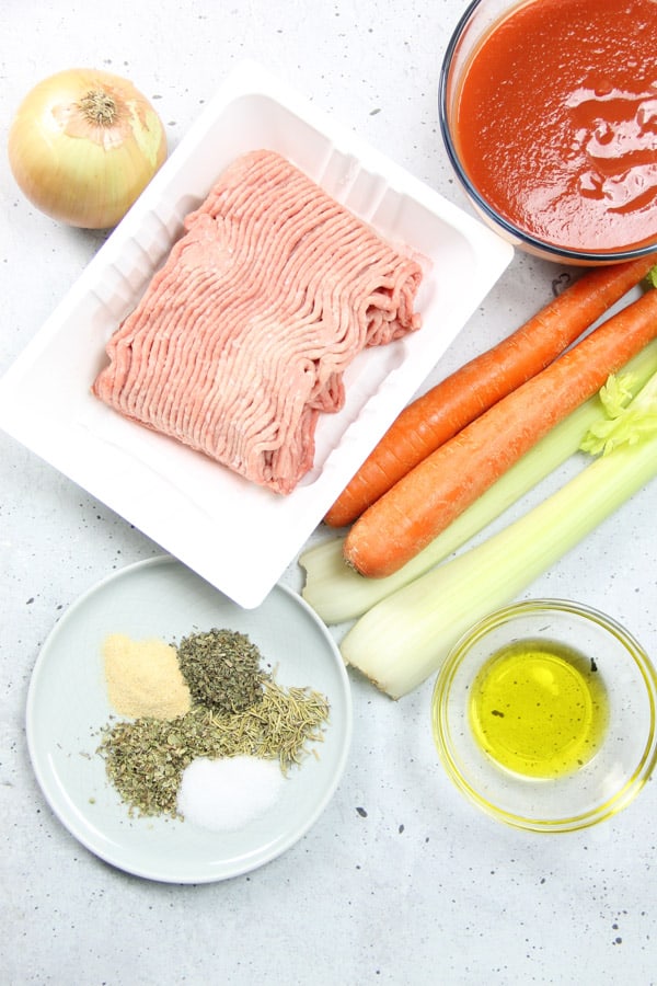 Easy Instant Pot Turkey Ragù! Made with ground turkey, herbs and tomato sauce this pasta sauce comes together quickly with the instant pot! Instant Pot Turkey Ragu ingredients