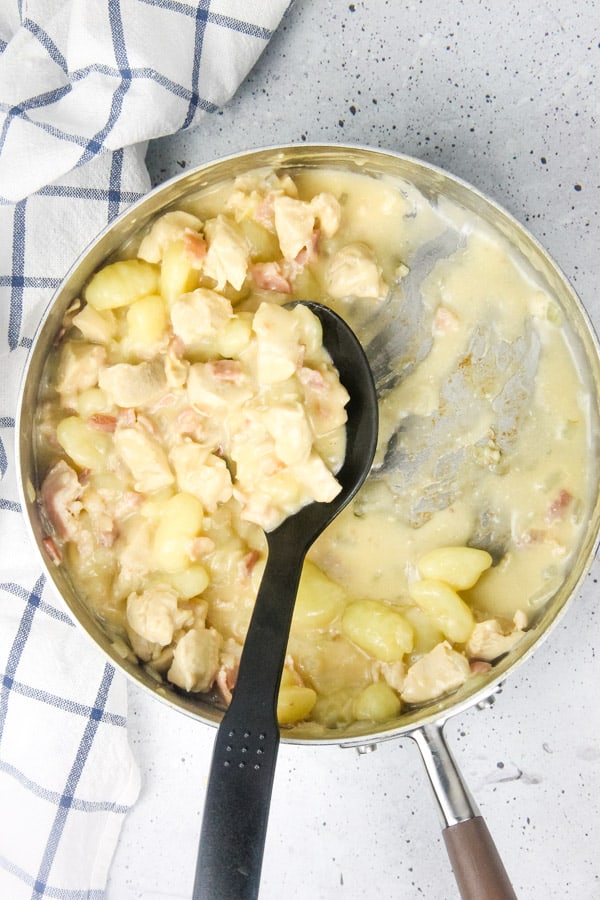 This Chicken Bacon Gnocchi Skillet is a delicious one pot meal! With tender chicken, gnocchi and crispy bacon, it makes a complete meal! Chicken Bacon Gnocchi Skillet in skillet