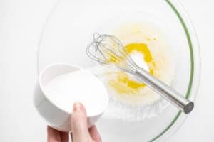 adding sugar into melted butter.