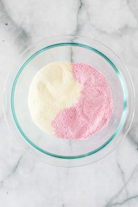 powdered milk and strawberry milk in bowl