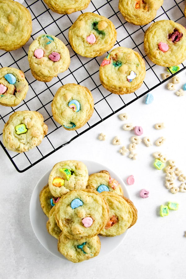 Lucky Sugar Cookies are a fun treat for the kids! I take my basic sugar cookie recipe and add Lucky Charms cereal to it! cookies on plate.