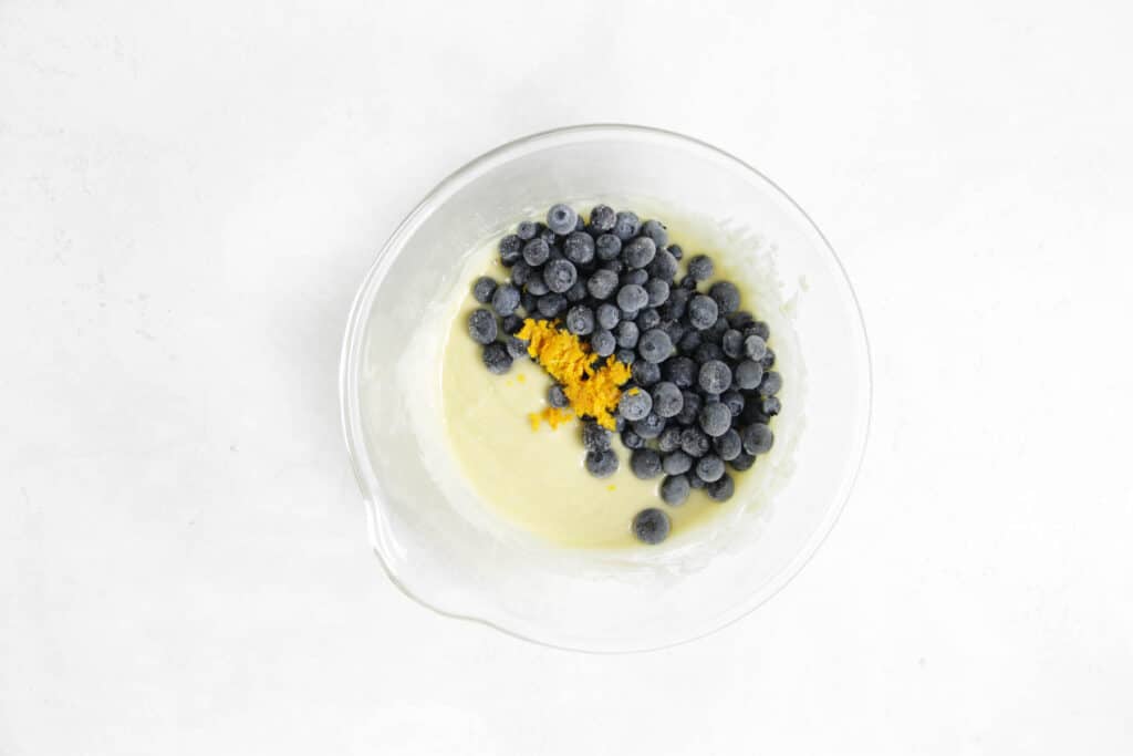 Adding in blueberries and orange zest