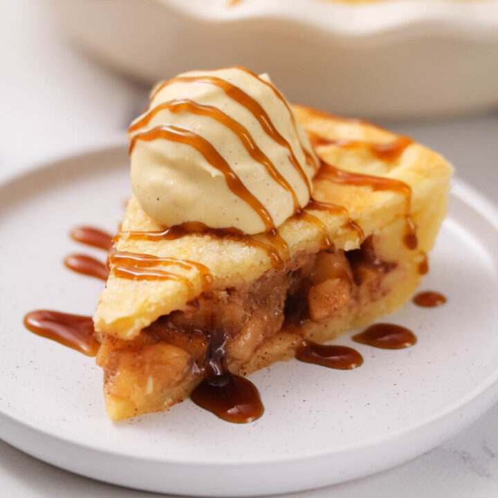 slice of pie on plate topped with ice cream.