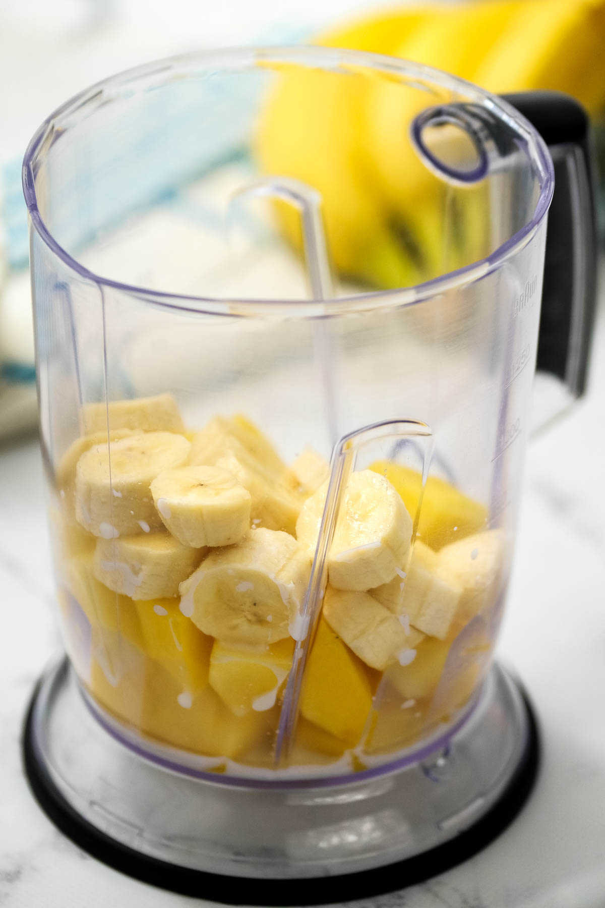 fruit and milk in blender.