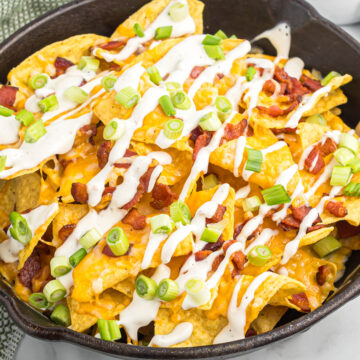 easy bacon ranch skillet nachos in black skillet