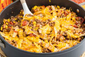 Easy taco skillet cooked in black pan with spoon.