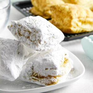 air fryer beignets on white plate.