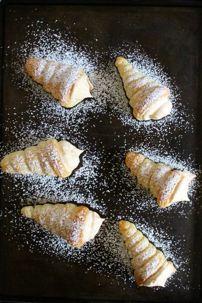 overhead view of cream horns on sheet pan.