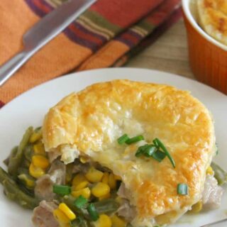 Leftover Turkey Puff Pastry Pot Pies on plate with fork.