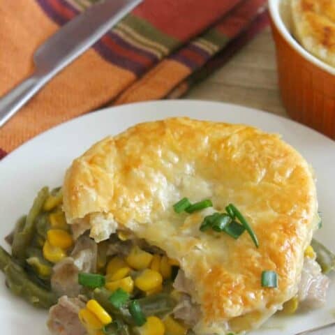 Leftover Turkey Puff Pastry Pot Pies on plate with fork.