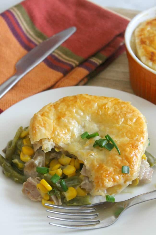 Leftover Turkey Puff Pastry Pot Pies on plate with fork.