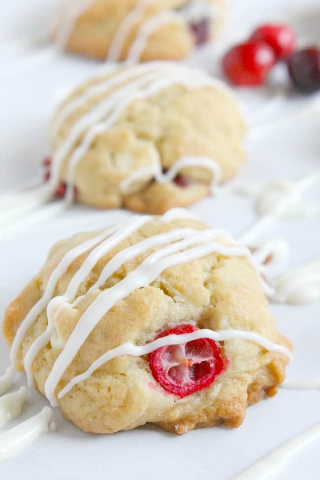 Cranberry White Chocolate Chip Cookies drizzled with chocolate.