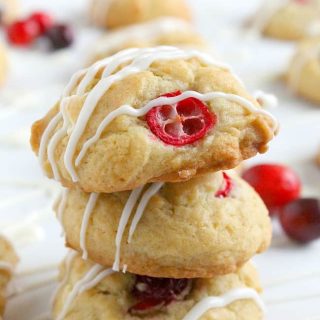 Cranberry White Chocolate Chip Cookies stacked on each other.