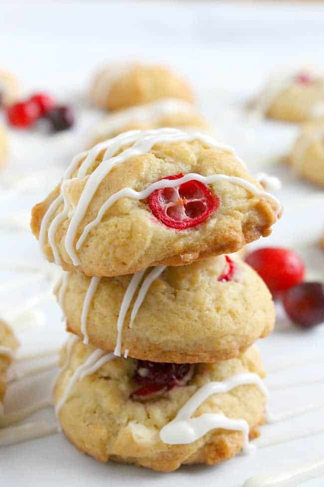 Cranberry White Chocolate Chip Cookies stacked on each other.
