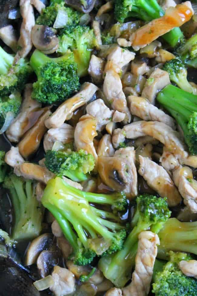 Broccoli Pork Stir Fry close up of broccoli, mushrooms and pork.