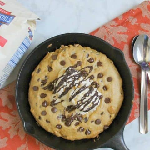 Chocolate Chip Pumpkin Skillet Cookie in skillet on orange napkin