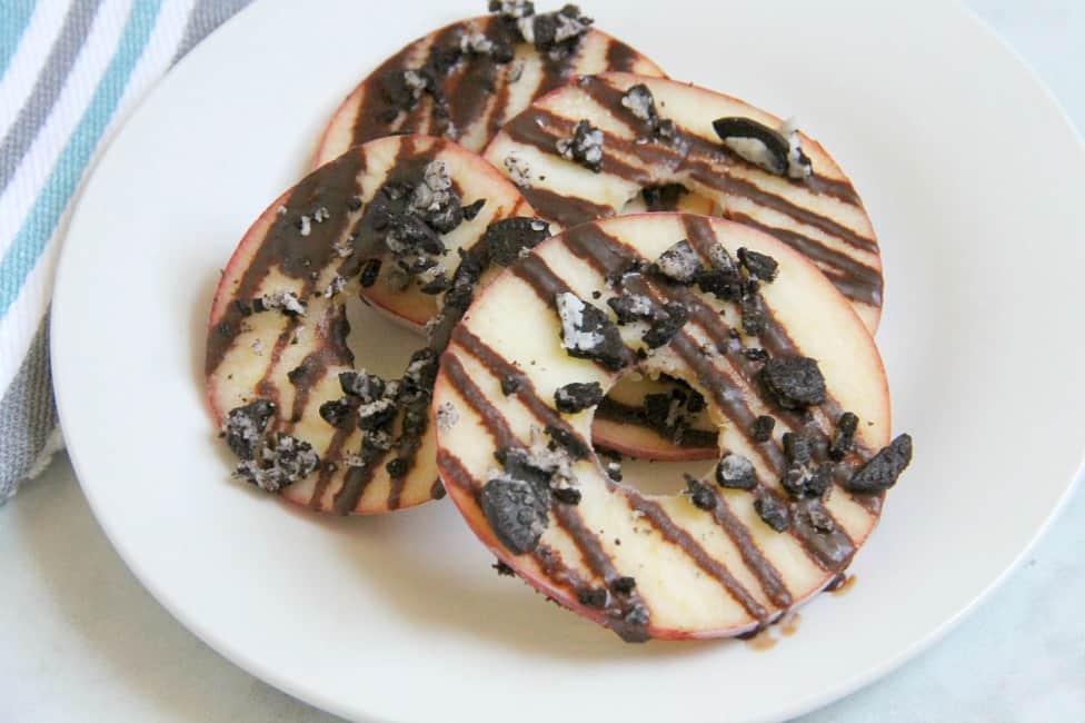 Chocolate Oreo Apple Donuts on white plate