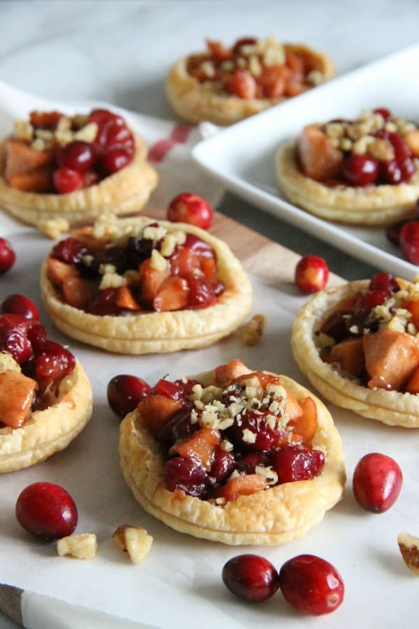 Cranberry Apple Walnut Tarts on parchment paper