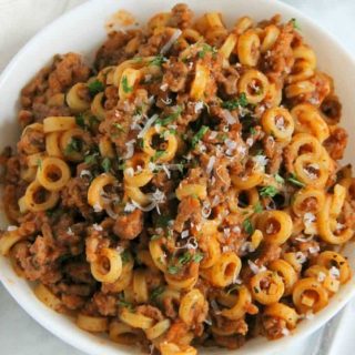 Homemade Spaghetti O's in white bowl