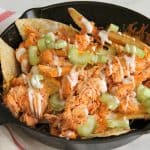 Buffalo Chicken Skillet Nachos in black skillet