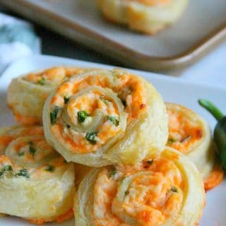 Puff Pastry Jalapeno Popper Pinwheels on white plate