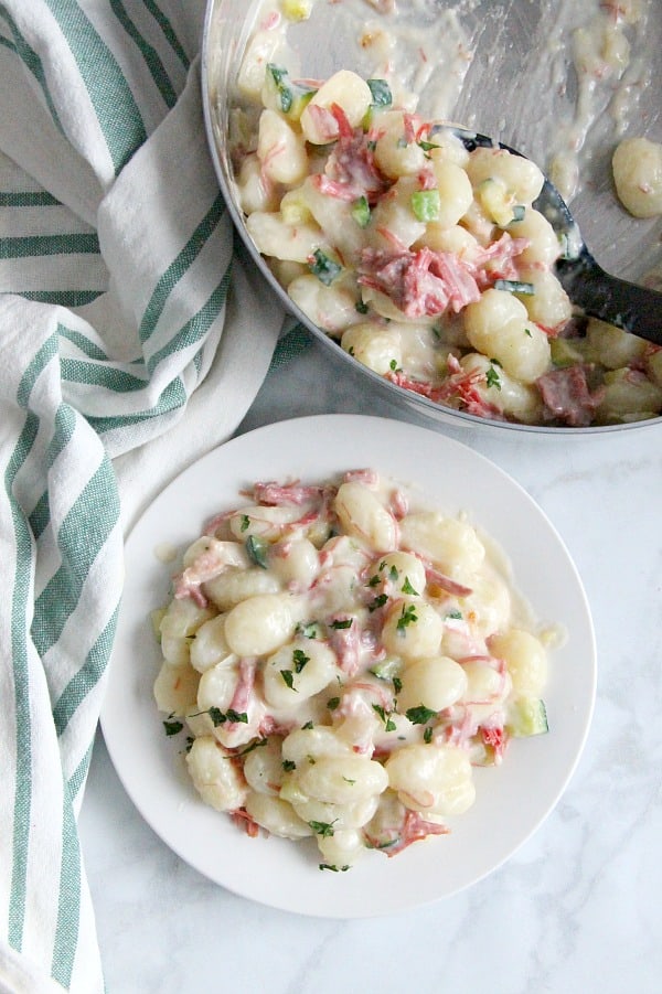 Creamy Gnocchi with Corned Beef and Zucchini on white plate