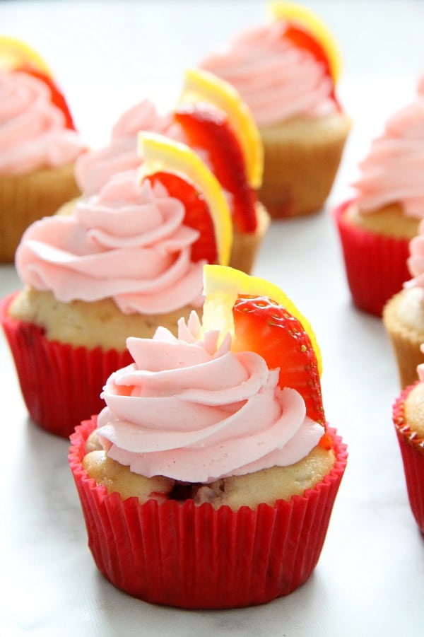 Strawberry Lemon Cupcakes with red cupcake liner on white background