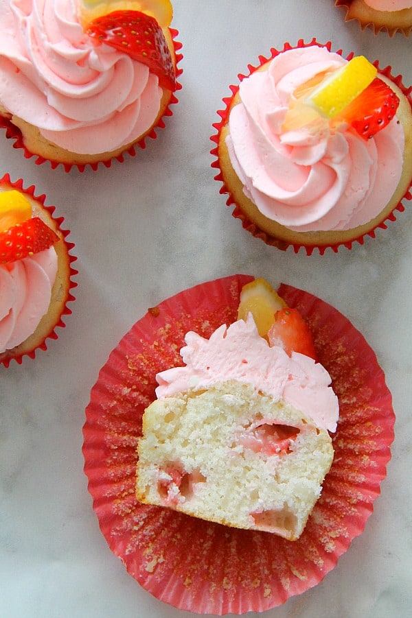 Strawberry Lemon Cupcakes with red cupcake liner on white background