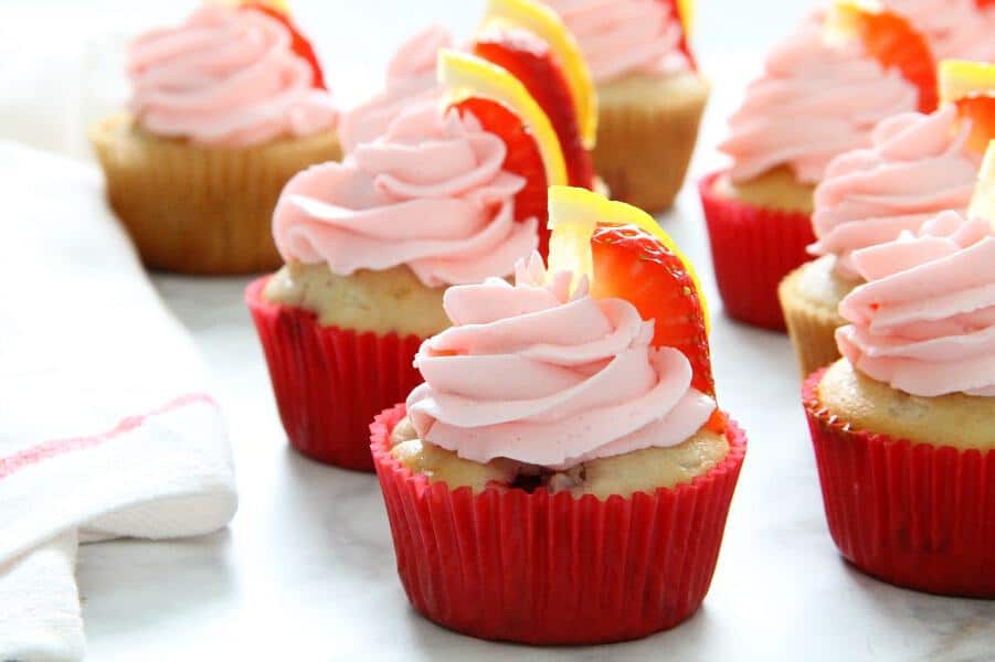 Strawberry Lemon Cupcakes with red cupcake liner on white background