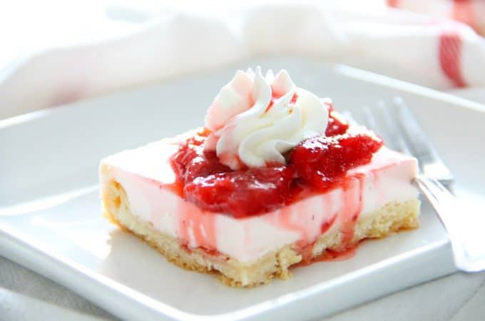 Strawberry Cheesecake Shortbread Bars on white plate