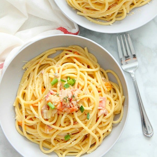 Bucatini with Tomatoes square image in grey bowl