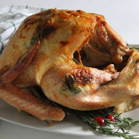 Butter Rosemary Roasted Turkey on white plate