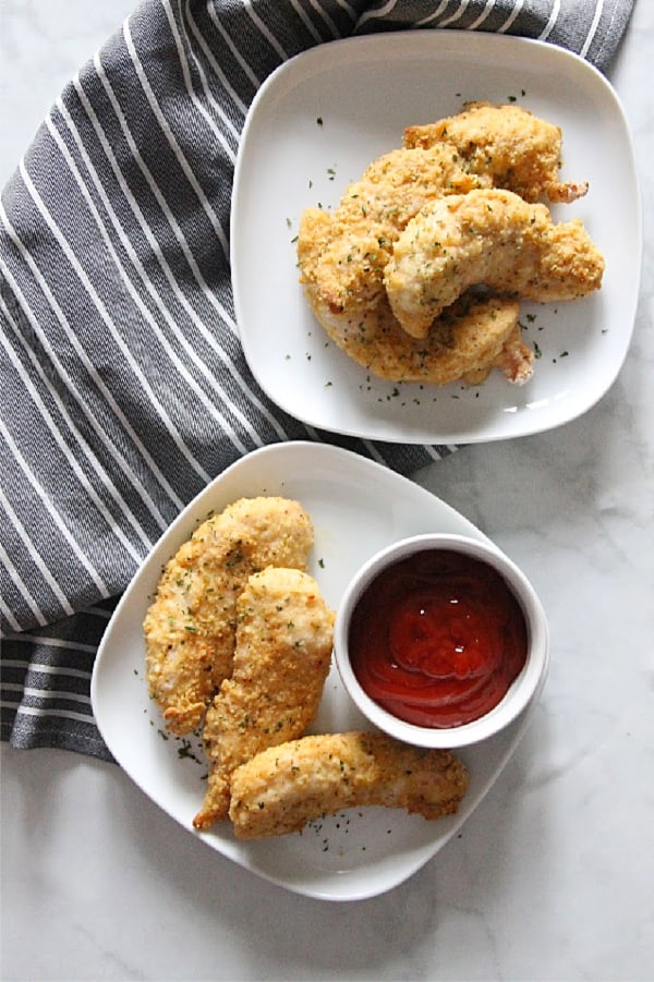 Easy Oven Baked Chicken Tenderloins on white plate