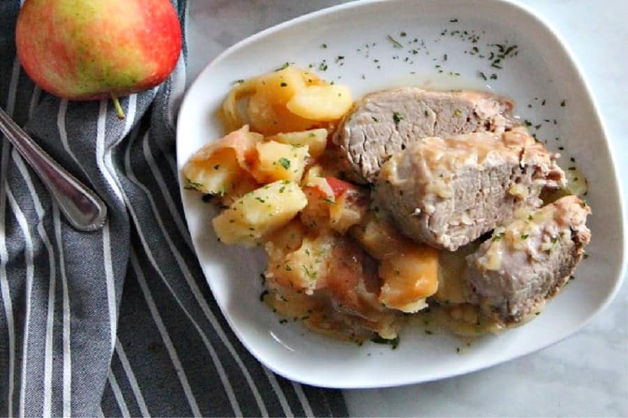 Instant Pot Pork Tenderloin with Apples and Onions on white plate