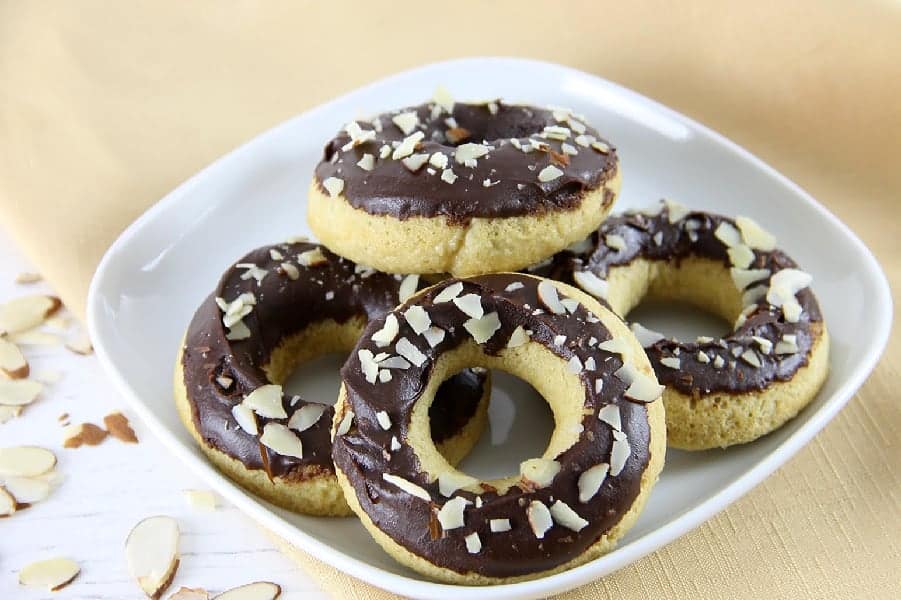 Chocolate Almond Glazed Donuts on white plate