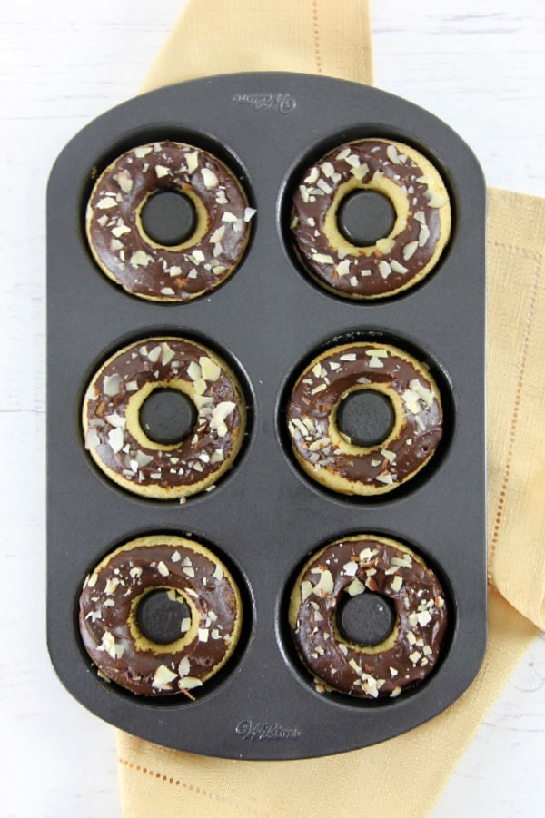 Chocolate Almond Glazed Donuts in donut pan