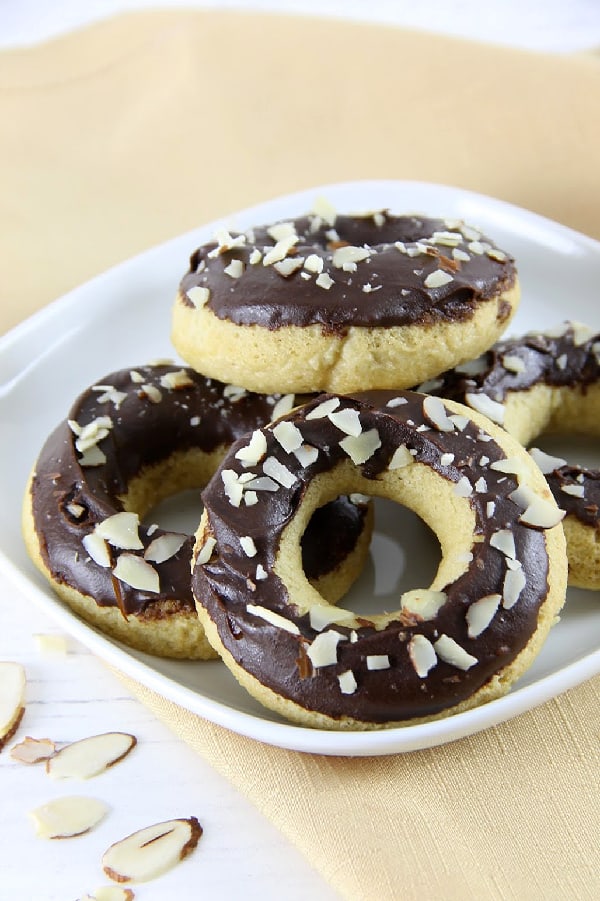 Chocolate Almond Glazed Donuts on white plate