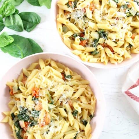 Creamy Tomato Spinach Pasta in bowls