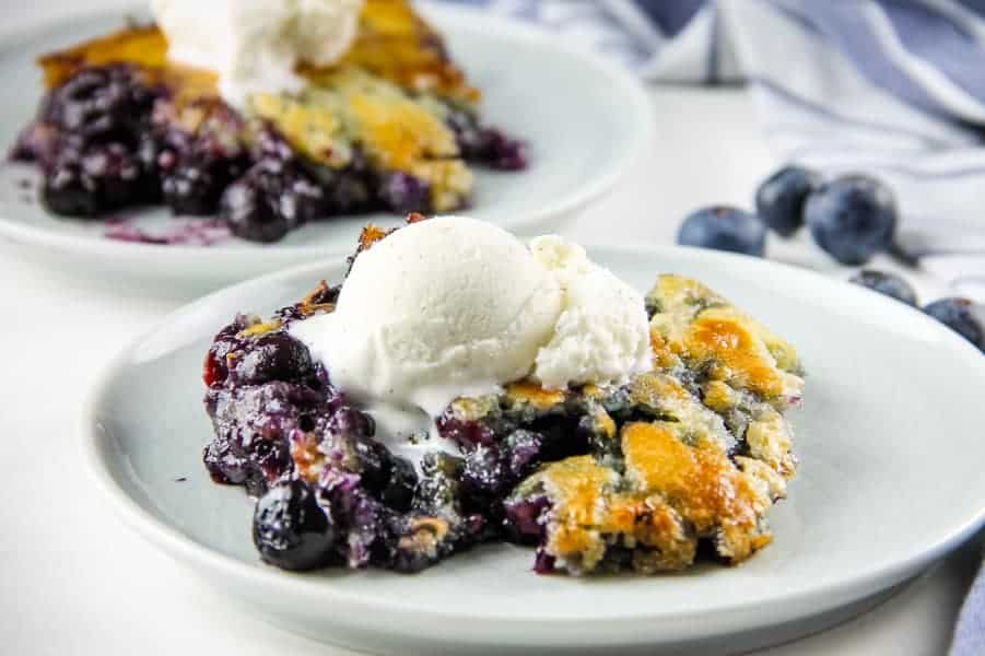 Blueberry Cobbler on white plate with ice cream