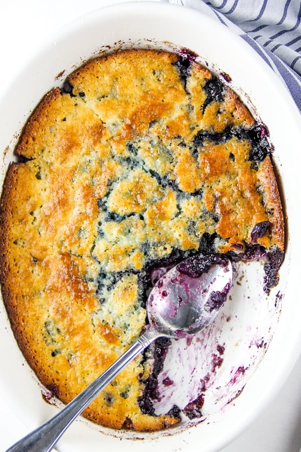 Blueberry Cobbler in white bowl with spoon