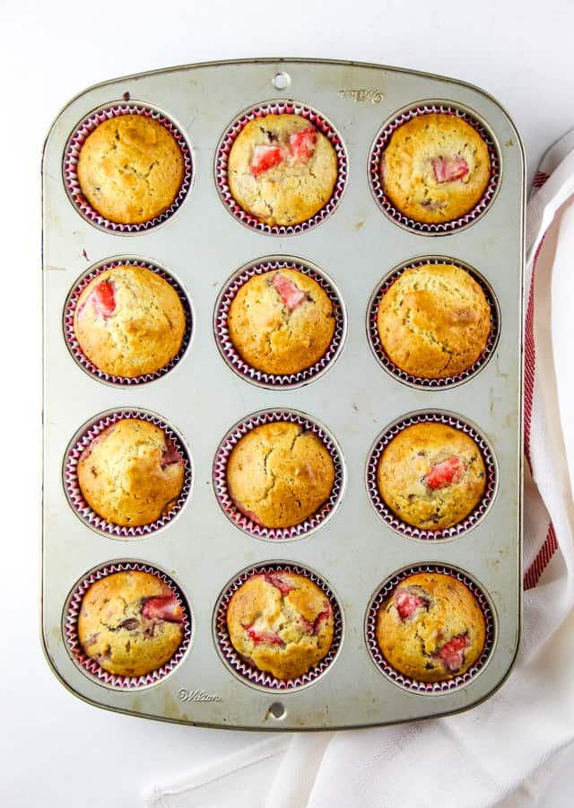 Strawberry Oatmeal Muffins overhead view of twelve muffins in cupcake pan