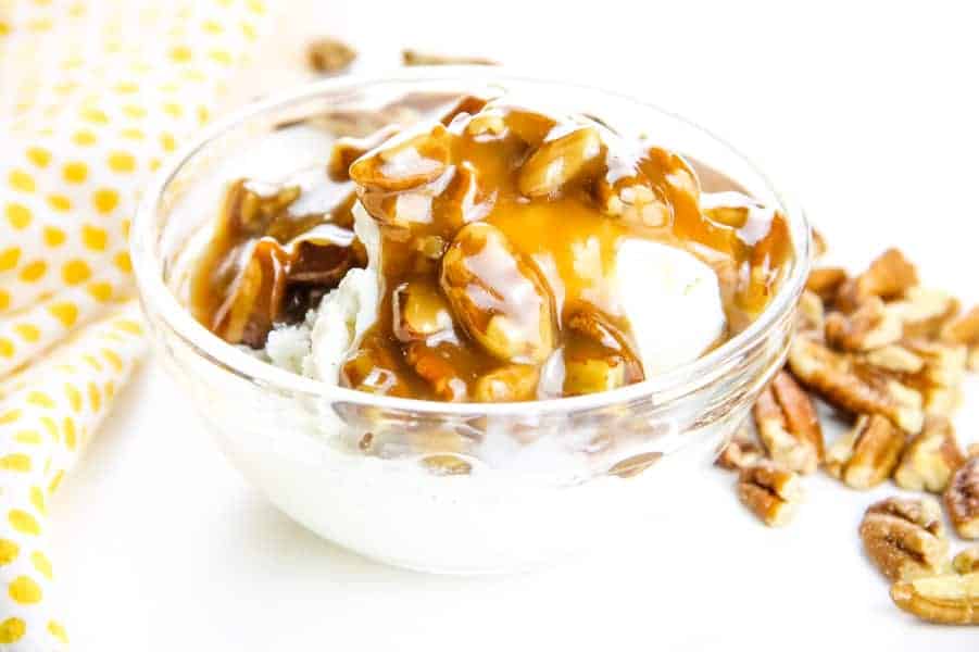 Butter Pecan Sauce in glass bowl over ice cream