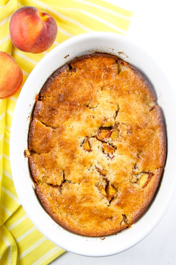 Peach Cobbler in white serving dish