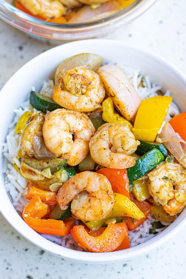 Garlic Thyme Shrimp and Veggies in white bowl with rice